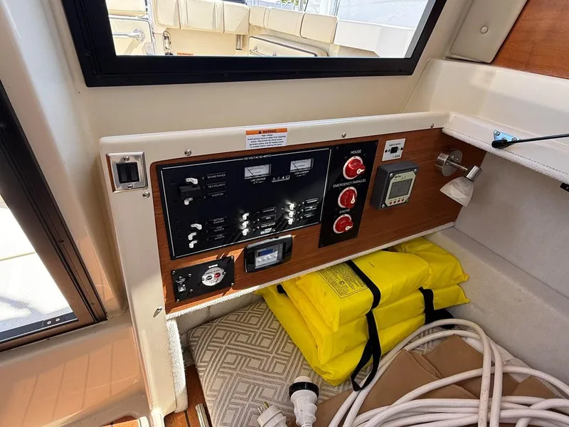 Slide: The Image of Control panel of a 2021 Ranger Tugs R-23 boat with safety equipment. - 20