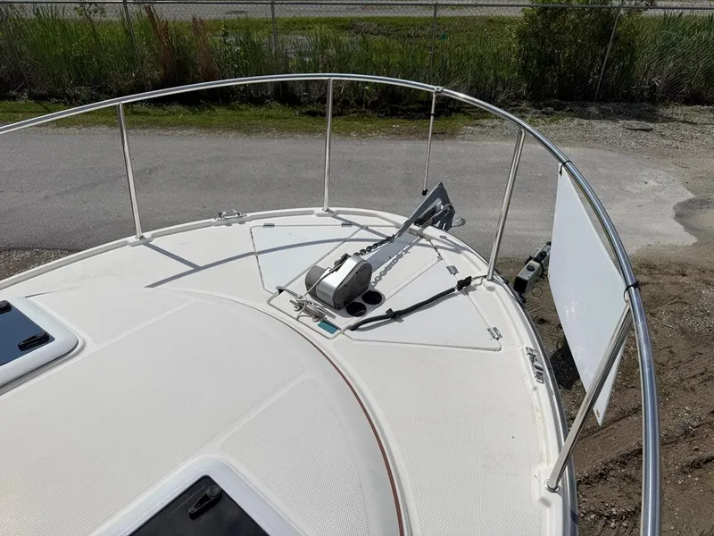 Slide: The Image of 2021 Ranger Tugs R-23 boat deck with anchor, railing, and hatches. - 21