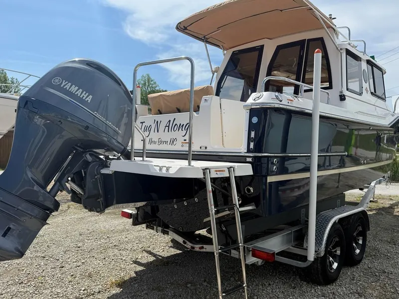 Slide: The Image of 2021 Ranger Tugs R-23 boat with Yamaha outboard motor on trailer. - 3