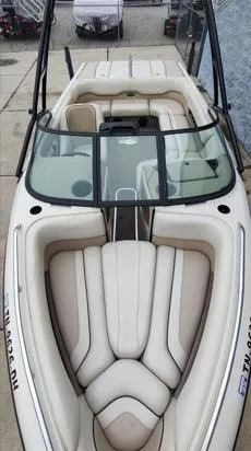 Slide: The Image of 2002 Malibu 23 LSV boat with beige interior and sleek design. - 4