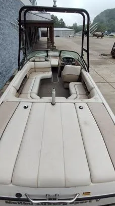 Slide: The Image of 2002 Malibu 23 LSV boat with spacious seating and wakeboard tower. - 8
