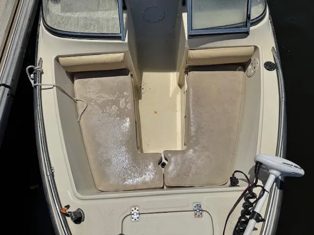 Slide: The Image of 1993 Key West 1720 DC boat interior with seating and trolling motor. - 17