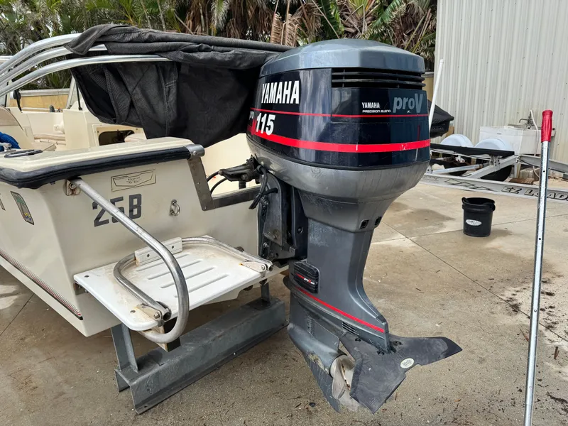 Slide: The Image of 1993 Key West 1720 DC boat with Yamaha 115 outboard motor, docked outdoors. - 8