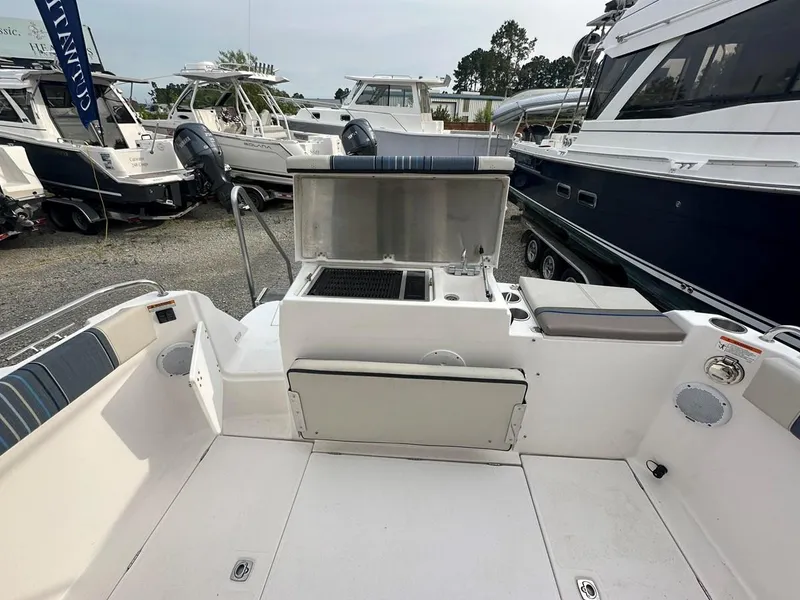 Slide: The Image of 2017 Cutwater C-24 boat deck with seating and storage, surrounded by other boats. - 5