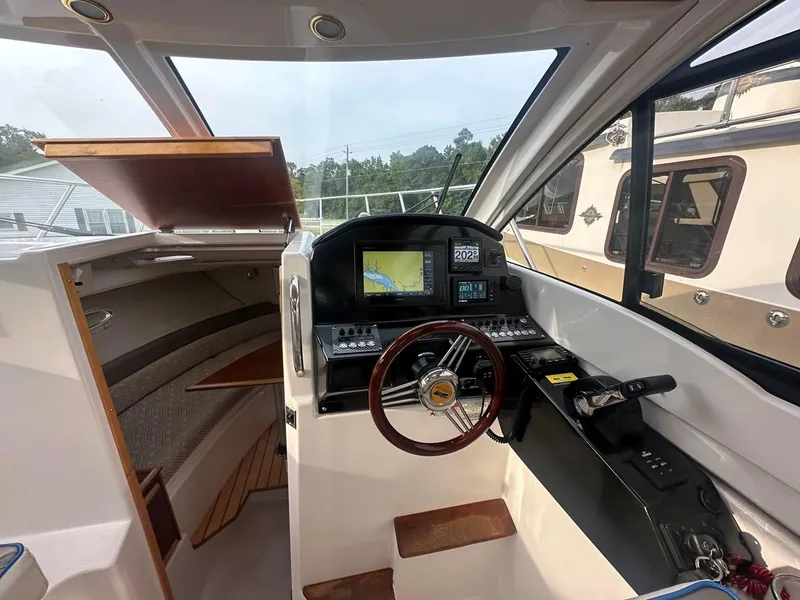 Slide: The Image of 2017 Cutwater C-24 boat interior with navigation controls and steering wheel. - 7
