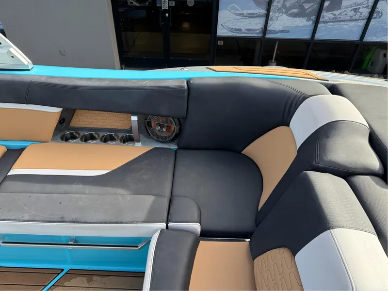 Slide: The Image of 2019 MasterCraft X24 boat interior with stylish seating and cup holders. - 18