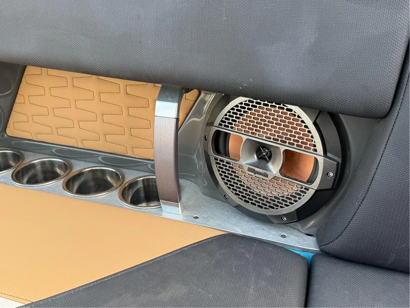 Slide: The Image of 2019 MasterCraft X24 interior with speaker and cup holders. - 19