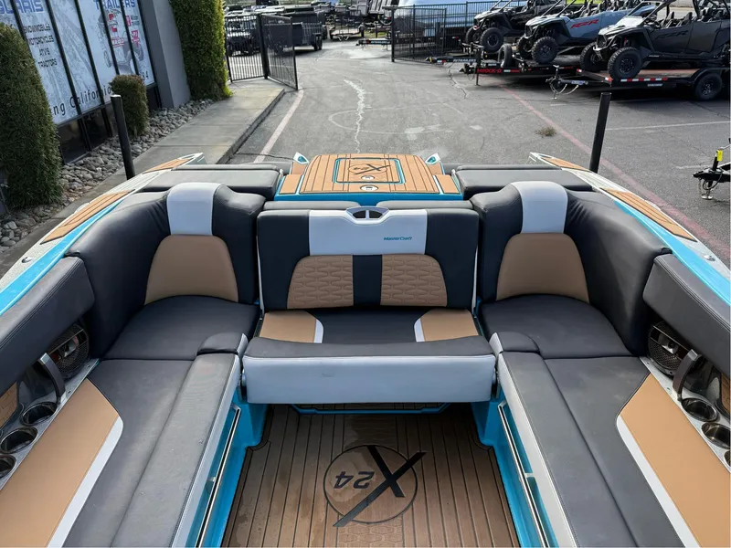 Slide: The Image of 2019 MasterCraft X24 boat interior with stylish seating and modern design. - 21