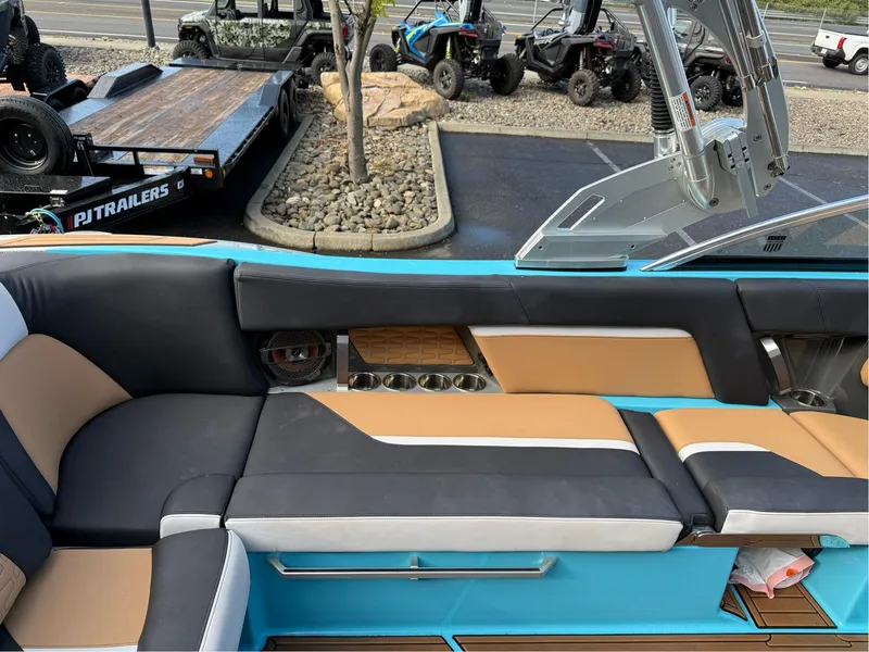Slide: The Image of 2019 MasterCraft X24 boat interior with stylish seating and cup holders. - 23