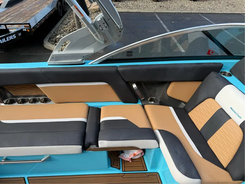 Slide: The Image of 2019 MasterCraft X24 boat interior with stylish seating and modern design. - 24