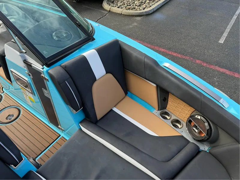 Slide: The Image of 2019 MasterCraft X24 boat interior with stylish seating and cup holders. - 26