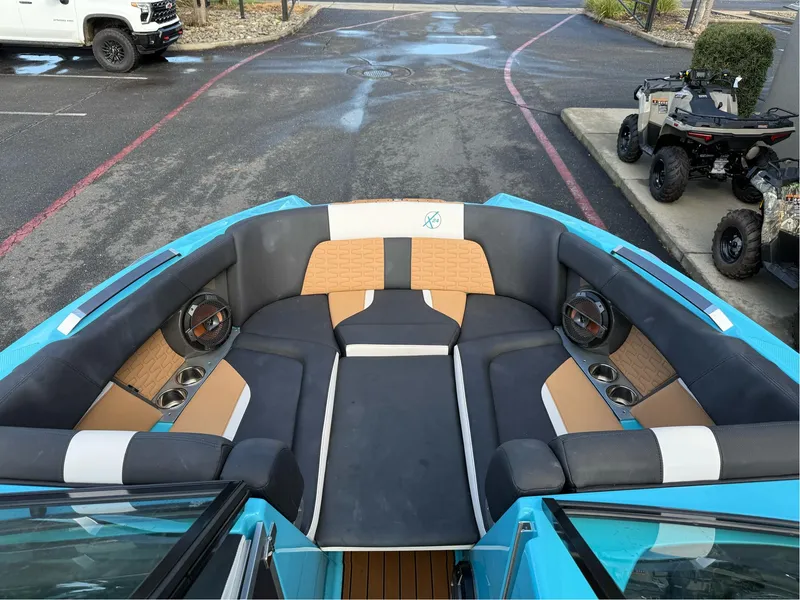 Slide: The Image of 2019 MasterCraft X24 boat interior with spacious seating and modern design. - 28