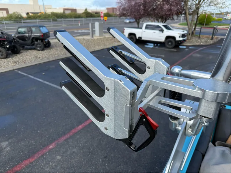 Slide: The Image of 2019 MasterCraft X24 wakeboard rack on a boat, parked in a lot. - 29