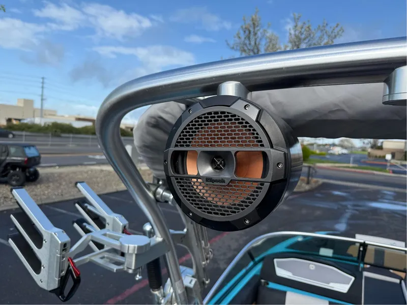 Slide: The Image of 2019 MasterCraft X24 boat with mounted speaker and wakeboard rack. - 30