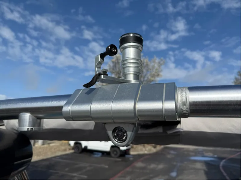 Slide: The Image of Close-up of a 2019 MasterCraft X24 boat component against a blue sky. - 31