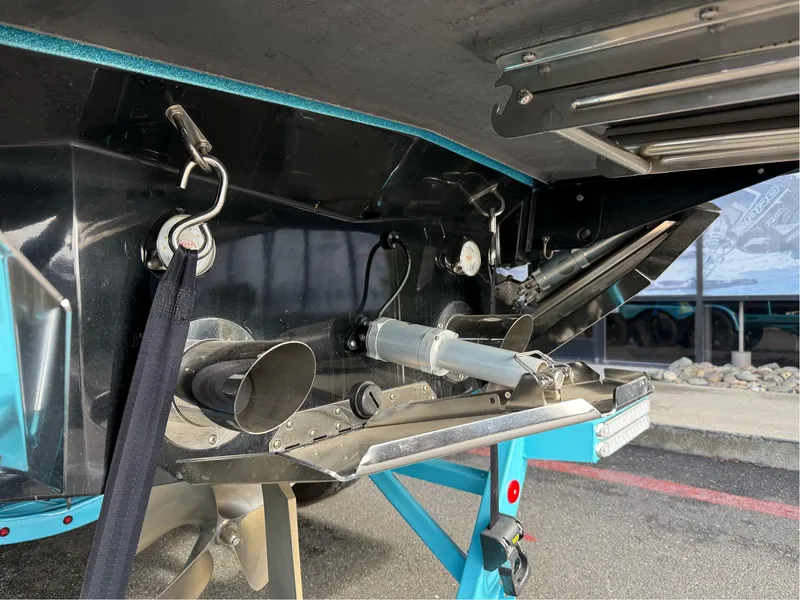 Slide: The Image of 2019 MasterCraft X24 boat underside showing propeller and exhaust system details. - 33