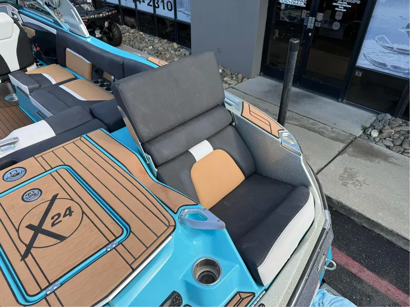 Slide: The Image of 2019 MasterCraft X24 boat interior with stylish seating and teak flooring. - 35