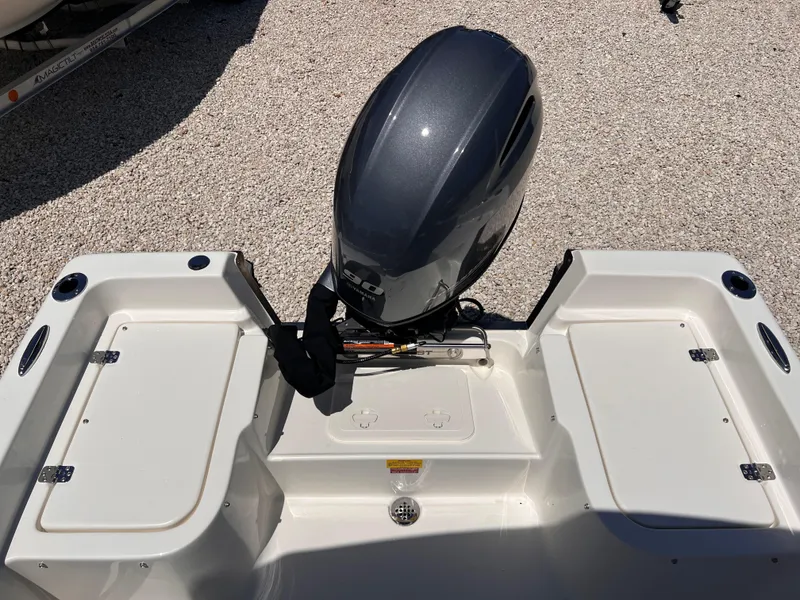 Slide: The Image of 2025 Key West 1720 Center Console boat with outboard motor, rear view. - 13