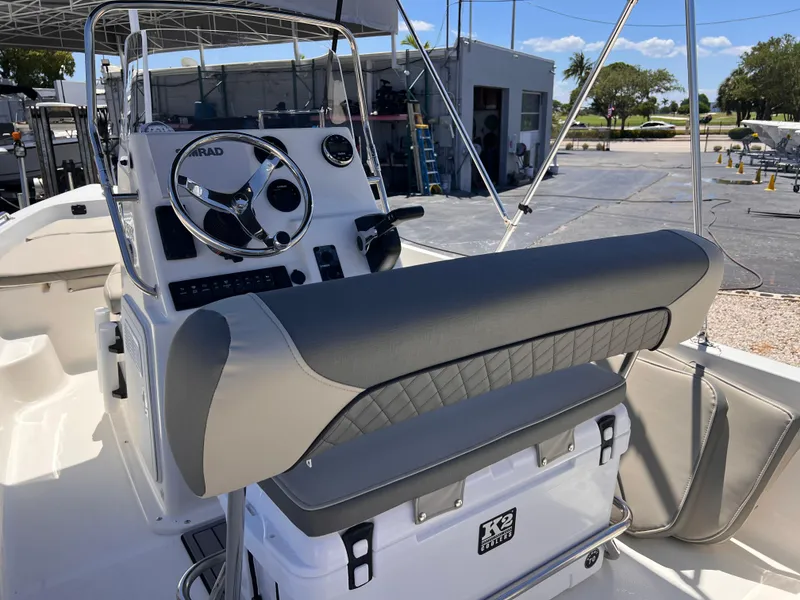 Slide: The Image of 2025 Key West 1720 Center Console boat interior with steering wheel and seating. - 14