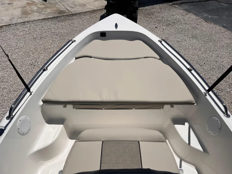 Slide: The Image of 2025 Key West 1720 Center Console boat interior with cushioned seating and sleek design. - 17