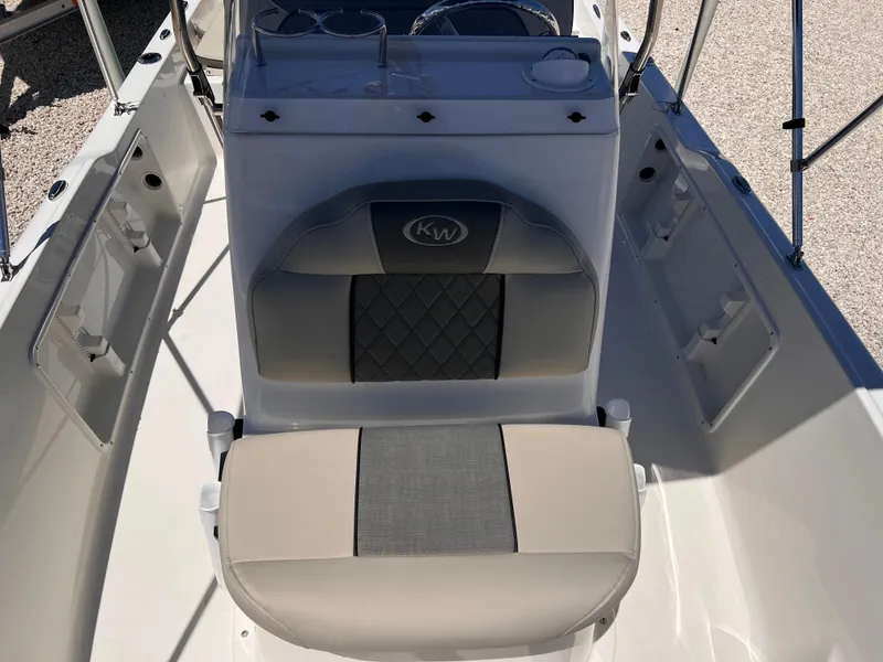 Slide: The Image of 2025 Key West 1720 Center Console boat interior with cushioned seating and console. - 20