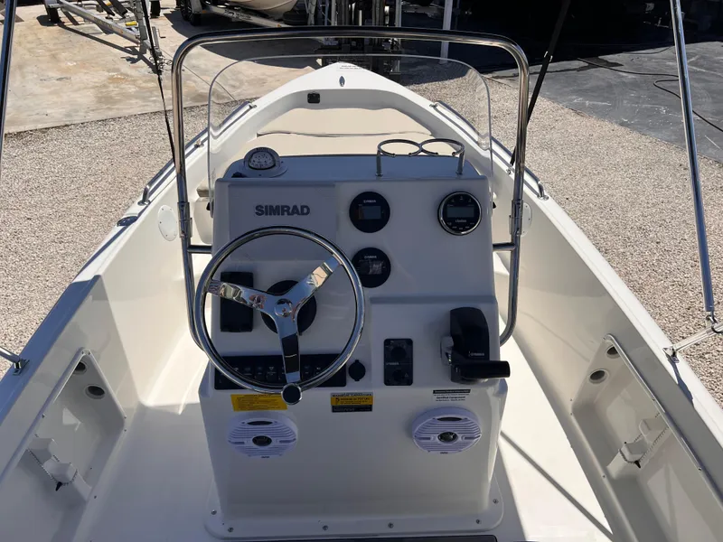 Slide: The Image of 2025 Key West 1720 Center Console boat interior with steering wheel and control panel. - 22