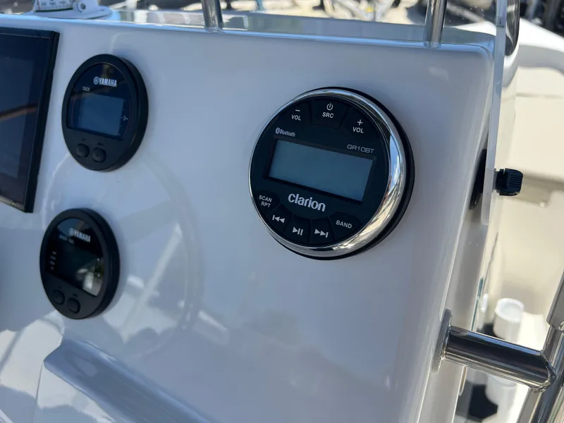 Slide: The Image of 2025 Key West 1720 Center Console dashboard with Clarion audio system and Yamaha controls. - 24