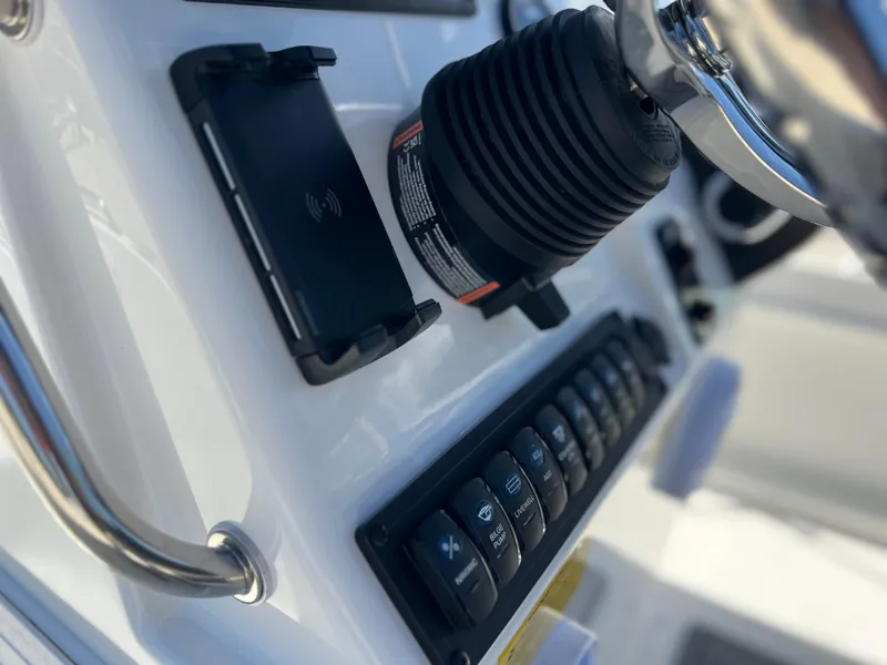 Slide: The Image of 2025 Key West 1720 Center Console dashboard with controls and steering wheel. - 25