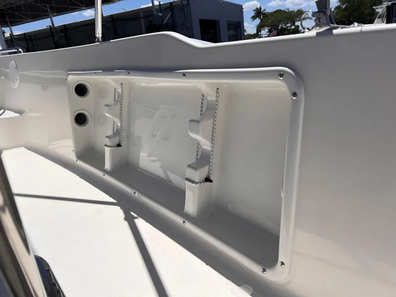 Slide: The Image of 2025 Key West 1720 Center Console boat interior detail with rod holders. - 28