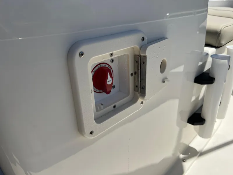 Slide: The Image of 2025 Key West 1720 Center Console boat battery switch in white compartment. - 32