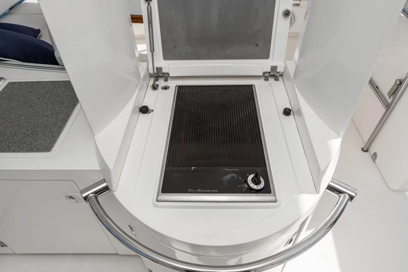 Slide: The Image of Outdoor grill on 2002 Fairline Squadron 58 yacht deck, featuring sleek design and modern amenities. - 25