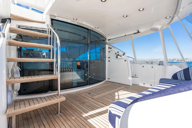 Slide: The Image of Luxurious 2002 Fairline Squadron 58 yacht interior with wooden deck and modern seating. - 33