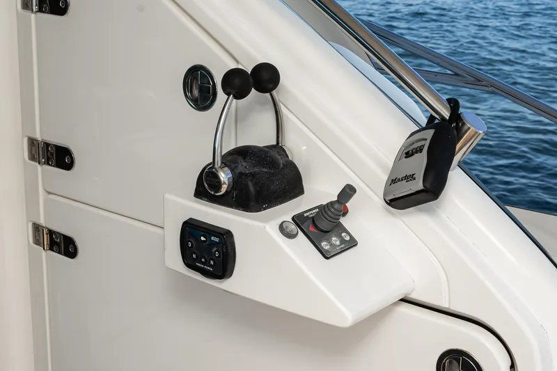 Slide: The Image of Control panel of 2002 Fairline Squadron 58 yacht with throttle and joystick. - 34