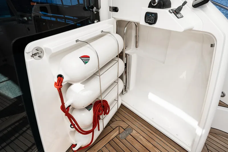 Slide: The Image of Storage compartment with life buoys on a 2002 Fairline Squadron 58 yacht. - 35
