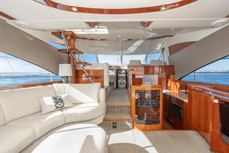 Slide: The Image of Luxurious interior of 2002 Fairline Squadron 58 yacht with elegant wood finishes and plush seating. - 37