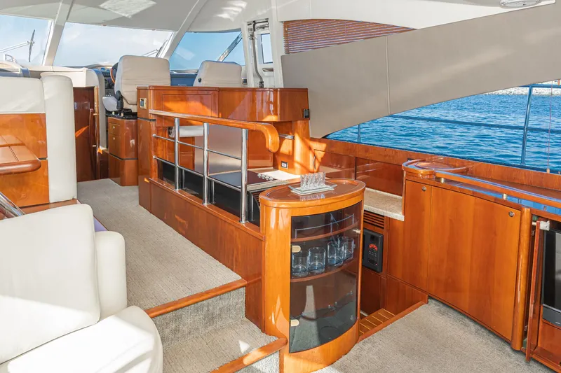 Slide: The Image of Luxurious interior of 2002 Fairline Squadron 58 yacht with elegant wood finishes and ocean view. - 42