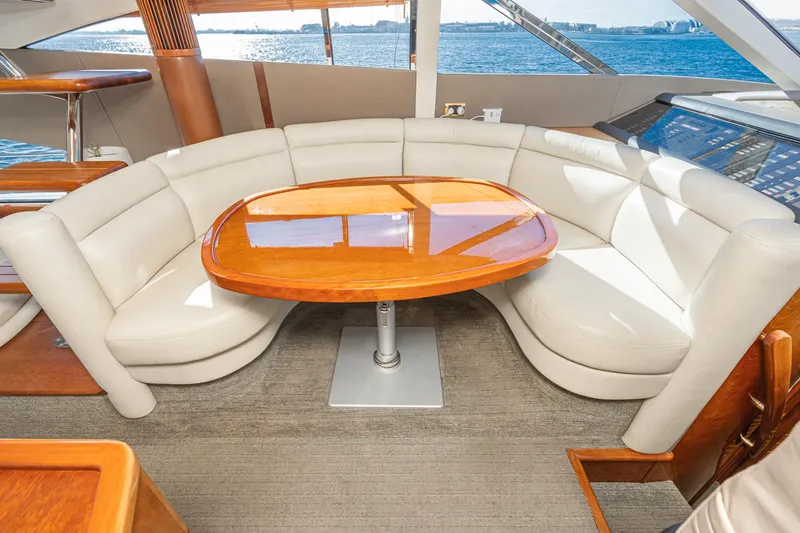 Slide: The Image of Luxurious 2002 Fairline Squadron 58 yacht interior with elegant seating and wooden table. - 49