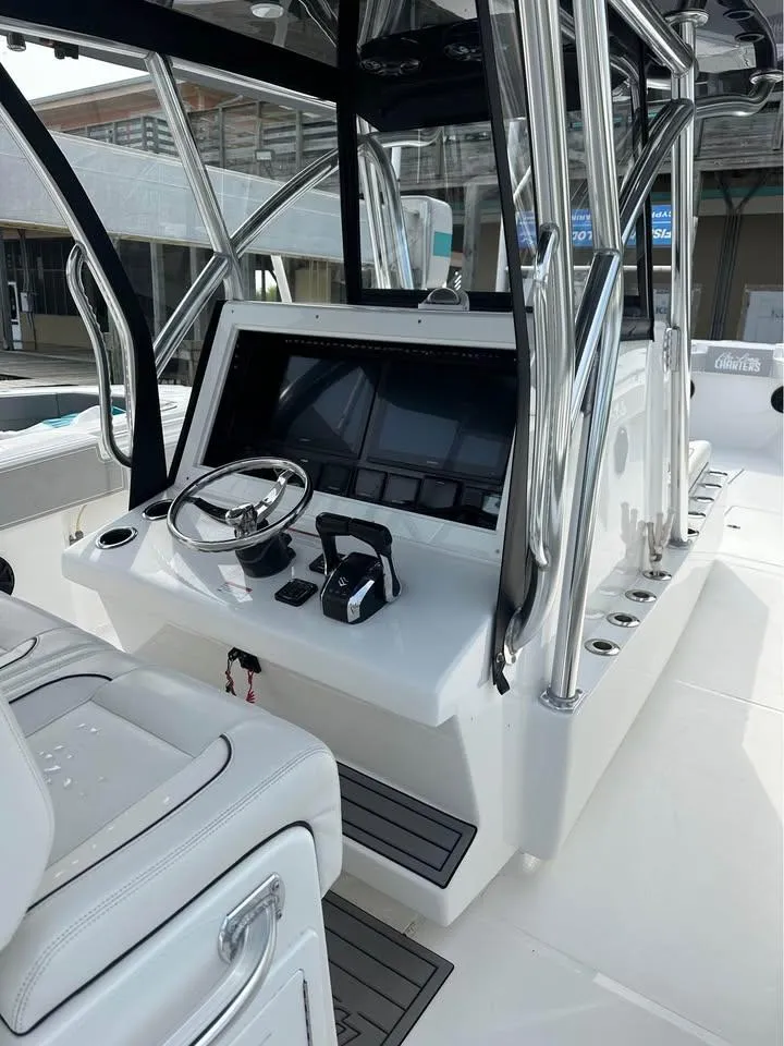 Slide: The Image of 2024 SeaHunter 39 Tournament boat cockpit with modern controls and sleek design. - 5
