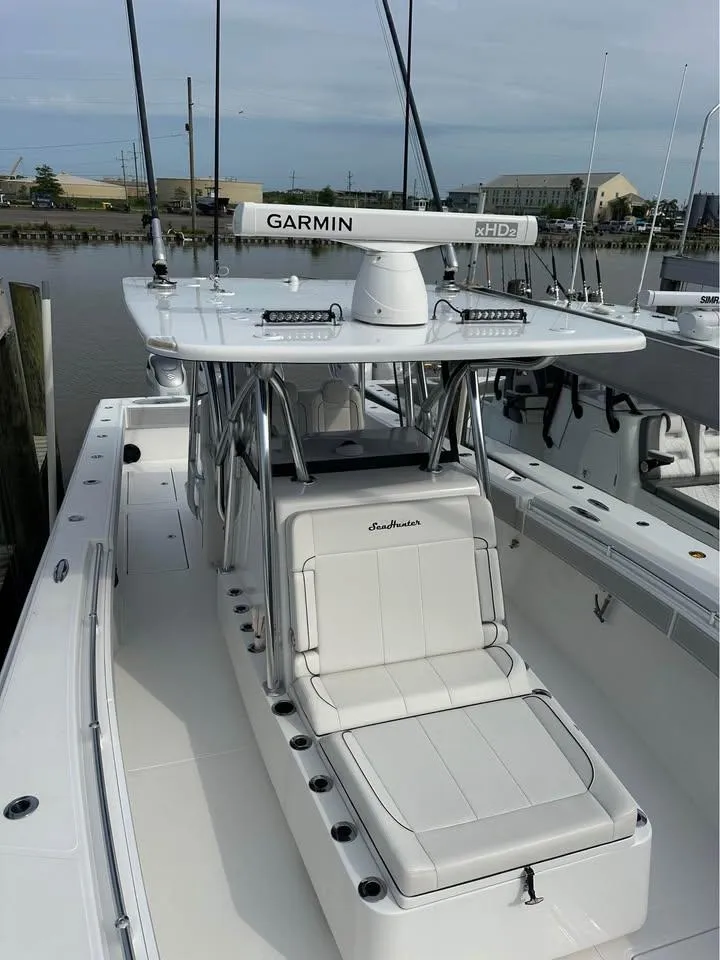 Slide: The Image of 2024 SeaHunter 39 Tournament boat with Garmin radar, docked in a marina. - 7