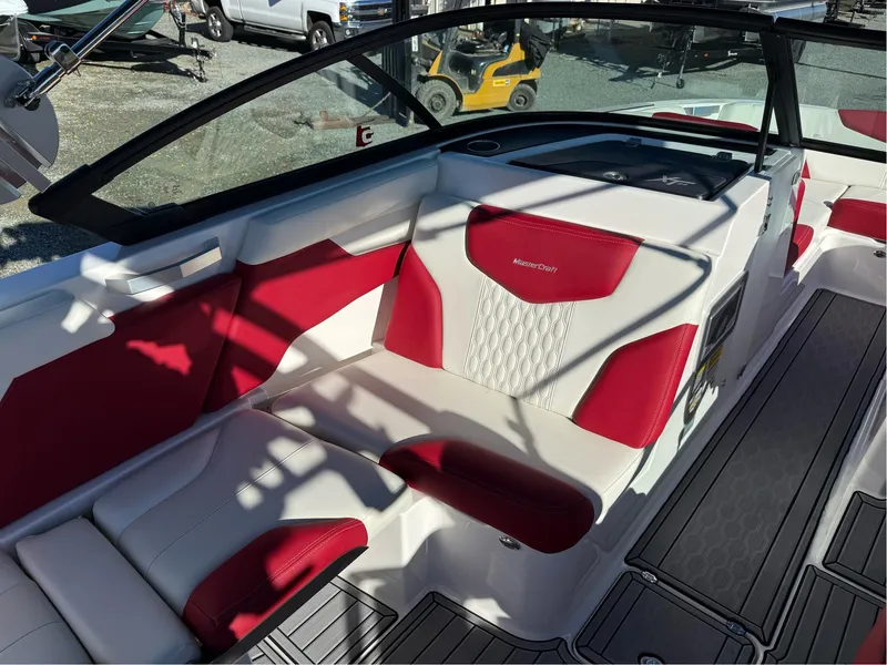 Slide: The Image of 2022 MasterCraft XT24 boat interior with red and white seating, modern design. - 18