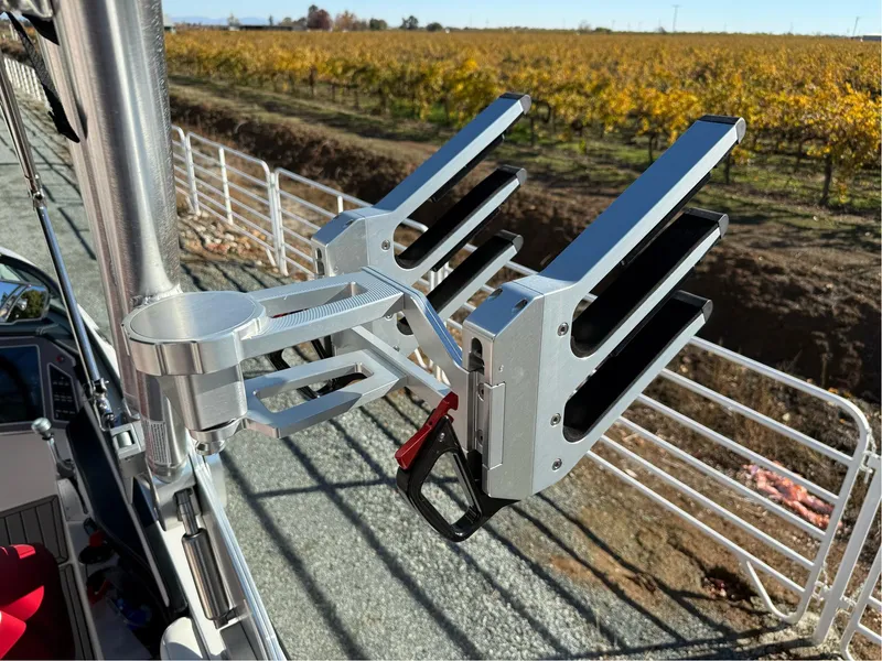 Slide: The Image of 2022 MasterCraft XT24 boat with a mounted wakeboard rack, vineyard background. - 27