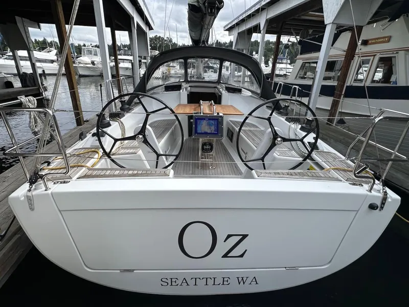 Slide: The Image of 2019 Hanse 348 sailboat docked, dual steering wheels, named "Oz," located in Seattle, WA. - 13