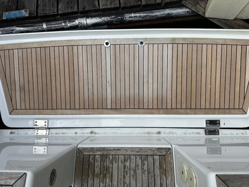 Slide: The Image of Hanse 348 2019 yacht deck with wooden finish and metal fittings. - 24