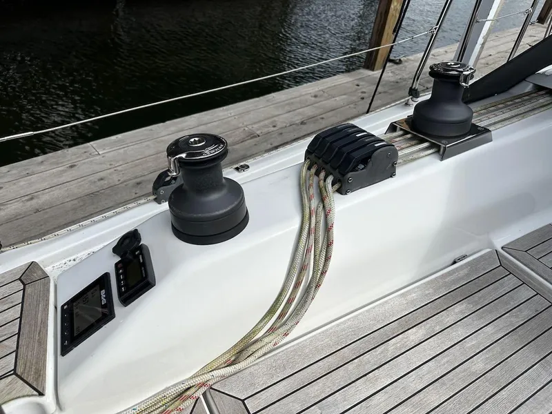 Slide: The Image of Deck of 2019 Hanse 348 sailboat with winches and rope clutches. - 25
