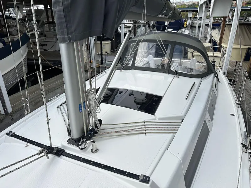 Slide: The Image of 2019 Hanse 348 sailboat docked, featuring sleek deck design and modern rigging. - 27