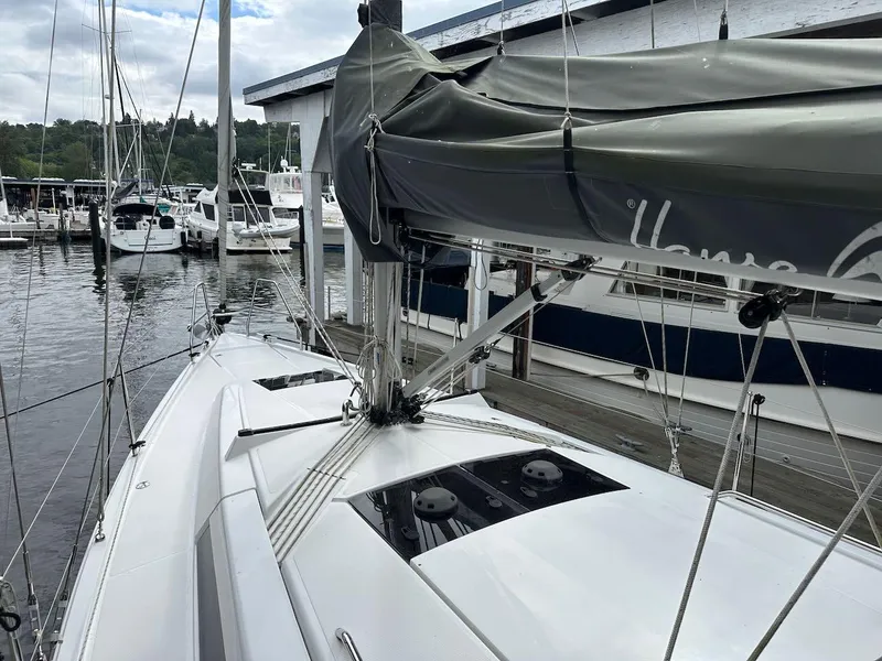 Slide: The Image of 2019 Hanse 348 sailboat docked at marina, featuring sleek design and modern rigging. - 29