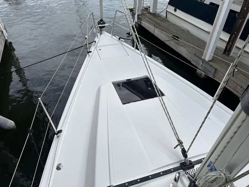 Slide: The Image of 2019 Hanse 348 sailboat deck, docked at marina, featuring sleek design and modern fittings. - 30
