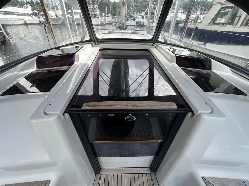 Slide: The Image of 2019 Hanse 348 yacht cockpit with sleek design and marina view. - 36