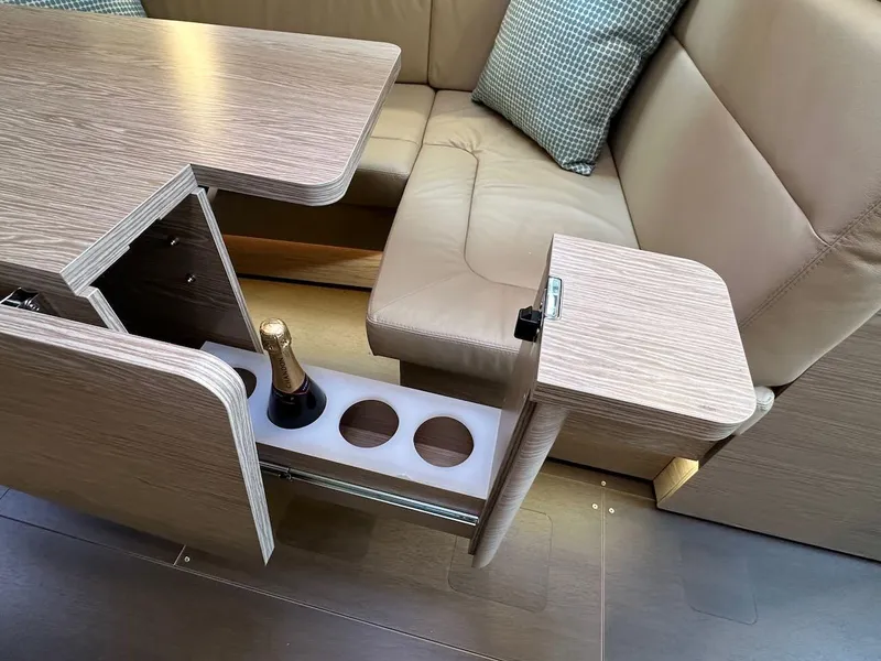 Slide: The Image of Luxurious interior of 2019 Hanse 348 yacht with built-in bottle storage and seating area. - 45