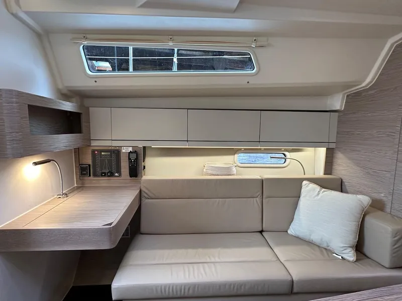 Slide: The Image of Interior of 2019 Hanse 348 yacht with modern sofa and desk area. - 46